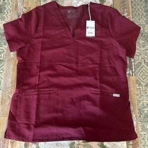 Burgundy Women’s XL figs Casma Three pocket scrub top. Never worn. Tags still on